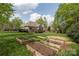 Spacious backyard featuring garden beds and outdoor living space at 233 Highland Forest Dr, Clover, SC 29710