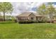 Spacious backyard with a well-maintained lawn, a fence, and a patio ideal for outdoor gatherings at 233 Highland Forest Dr, Clover, SC 29710