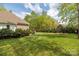Expansive backyard featuring a lush lawn, garden beds, and mature trees, perfect for outdoor enjoyment at 233 Highland Forest Dr, Clover, SC 29710