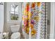 Bathroom featuring a floral shower curtain and a toilet with chrome fixtures at 233 Highland Forest Dr, Clover, SC 29710