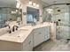 Modern bathroom with double sinks, white countertops, and a glass-enclosed shower with marble tiling at 233 Highland Forest Dr, Clover, SC 29710
