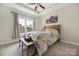Comfortable bedroom with a ceiling fan, a wooden bed frame, and a bench seat at 233 Highland Forest Dr, Clover, SC 29710