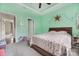 Cozy bedroom with a wooden bed frame, mint walls, and a doorway leading to another room at 233 Highland Forest Dr, Clover, SC 29710