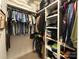 Organized walk-in closet with clothing racks, shelves, and carpeted flooring at 233 Highland Forest Dr, Clover, SC 29710