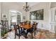 Formal dining room featuring a large window, chandelier, and hardwood floors at 233 Highland Forest Dr, Clover, SC 29710
