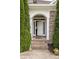 Arched front entry with brick steps and columns, flanked by symmetrical shrubs at 233 Highland Forest Dr, Clover, SC 29710