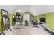 Spacious bonus room featuring an elliptical, workout equipment, and bright green walls at 233 Highland Forest Dr, Clover, SC 29710