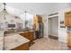Kitchen opens to great room featuring stainless appliances, granite counters, and tile floor at 233 Highland Forest Dr, Clover, SC 29710