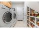 Laundry room with front load washer and dryer with shelving for storage at 233 Highland Forest Dr, Clover, SC 29710