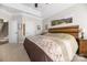 Spacious main bedroom with neutral paint, tray ceilings, and access to the staircase at 233 Highland Forest Dr, Clover, SC 29710