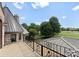 View from covered balcony of manicured backyard and green space at 300 Eagle Bend Dr, Waxhaw, NC 28173