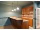 Finished basement bar area with granite countertops and light fixtures at 300 Eagle Bend Dr, Waxhaw, NC 28173