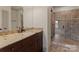 Bathroom with granite counters, and glass enclosed tiled shower at 300 Eagle Bend Dr, Waxhaw, NC 28173