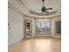 Bedroom featuring tray ceilings, hardwood floors, large windows, and access to the outdoors at 300 Eagle Bend Dr, Waxhaw, NC 28173
