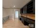 Spacious bonus room with custom built-in desk and cabinets providing ample storage space at 300 Eagle Bend Dr, Waxhaw, NC 28173