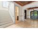 Elegant foyer with hardwood floors, a staircase, and an arched doorway at 300 Eagle Bend Dr, Waxhaw, NC 28173