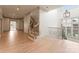 Bright foyer with hardwood floors, staircase with ornate railings, and clerestory windows at 300 Eagle Bend Dr, Waxhaw, NC 28173
