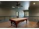Spacious game room with pool table, neutral decor, and ample space for entertaining at 300 Eagle Bend Dr, Waxhaw, NC 28173