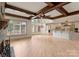 Open floor plan with hardwood floors, a fireplace, and a view of the modern kitchen at 300 Eagle Bend Dr, Waxhaw, NC 28173