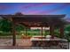 A fully equipped outdoor kitchen with a built-in grill and bar, ideal for backyard gatherings at 300 Eagle Bend Dr, Waxhaw, NC 28173