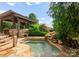 Relaxing spa and covered outdoor living area surrounded by lush landscaping at 300 Eagle Bend Dr, Waxhaw, NC 28173