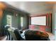 Home theater room with plush seating, curtains and large screen for immersive entertainment at 300 Eagle Bend Dr, Waxhaw, NC 28173