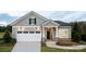 Charming single-Gathering home featuring a two-car garage and inviting stone and gray facade at 4138 Eastover Glen Rd # 0320, Charlotte, NC 28269