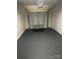 Attached garage with freshly painted walls and epoxy flooring at 961 Poplar Forest Rdg, Clover, SC 29710