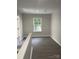 Upstairs landing with hardwood floors and window showing an abundance of natural light at 961 Poplar Forest Rdg, Clover, SC 29710