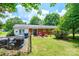 Backyard featuring a patio set and large trees providing a shady, relaxing space at 1008 2Nd Se St, Conover, NC 28613