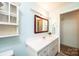 Bathroom with a single sink vanity, a mirror, and a medicine cabinet on the wall at 1008 2Nd Se St, Conover, NC 28613