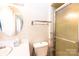 Bathroom with a vanity, a toilet, a glass-enclosed shower, and a round mirror at 1008 2Nd Se St, Conover, NC 28613
