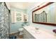 Well-lit bathroom with a large mirror, a sink vanity, and a shower/tub combination at 1008 2Nd Se St, Conover, NC 28613