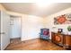 Charming bedroom featuring hardwood floors, decorative chair, and an art deco style cabinet at 1008 2Nd Se St, Conover, NC 28613