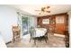 Dining area featuring sliding glass doors with curtains, a round table, and a brick wall at 1008 2Nd Se St, Conover, NC 28613