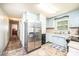 Well-lit kitchen with stainless steel appliances, ample counter space, and easy access to hallway at 1008 2Nd Se St, Conover, NC 28613