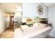 Kitchen with stainless steel refrigerator, breakfast bar, and easy access to the hallway at 1008 2Nd Se St, Conover, NC 28613