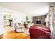 Inviting living room featuring a brick fireplace, hardwood floors, and a cozy seating arrangement at 1008 2Nd Se St, Conover, NC 28613
