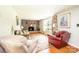Comfortable living room with a brick fireplace, hardwood flooring, and plenty of natural light at 1008 2Nd Se St, Conover, NC 28613