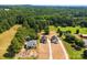Aerial view of new homes on spacious lots with mature trees and a community pool at 1017 S Main St, Granite Quarry, NC 28146