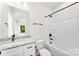 Bathroom with a granite vanity, white cabinets, and a bathtub with shower at 1017 S Main St, Granite Quarry, NC 28146