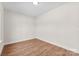 Bright bedroom boasts light wood floors and white walls, ready for personal touches at 1017 S Main St, Granite Quarry, NC 28146