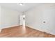 A bedroom showcasing wood flooring, white walls, trim and doors, and a ceiling light at 1017 S Main St, Granite Quarry, NC 28146
