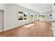 Bright, open-concept living room with wood floors and many windows at 1017 S Main St, Granite Quarry, NC 28146