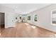 Bright, open-concept living room with wood floors and abundant natural light at 1017 S Main St, Granite Quarry, NC 28146