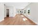 Bright, open-concept living room with wood floors and abundant natural light at 1017 S Main St, Granite Quarry, NC 28146
