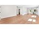 Bright, open-concept living room with wood floors and modern lighting at 1017 S Main St, Granite Quarry, NC 28146