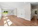 Bright, open-concept living room with wood floors and natural light at 1017 S Main St, Granite Quarry, NC 28146