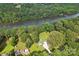 Aerial view showcasing the property, pool, and scenic river frontage at 3770 Buck Point Rd, Catawba, NC 28609