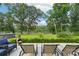 Beautiful backyard with mature trees, a patio, and a serene river view at 3770 Buck Point Rd, Catawba, NC 28609